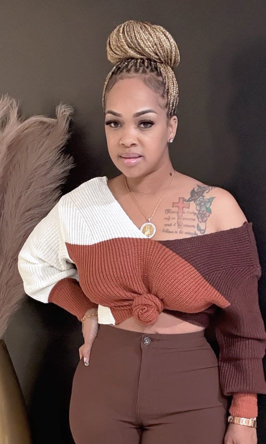 Front view of model wearing Red Fallover oversized sweater with bold color block design.