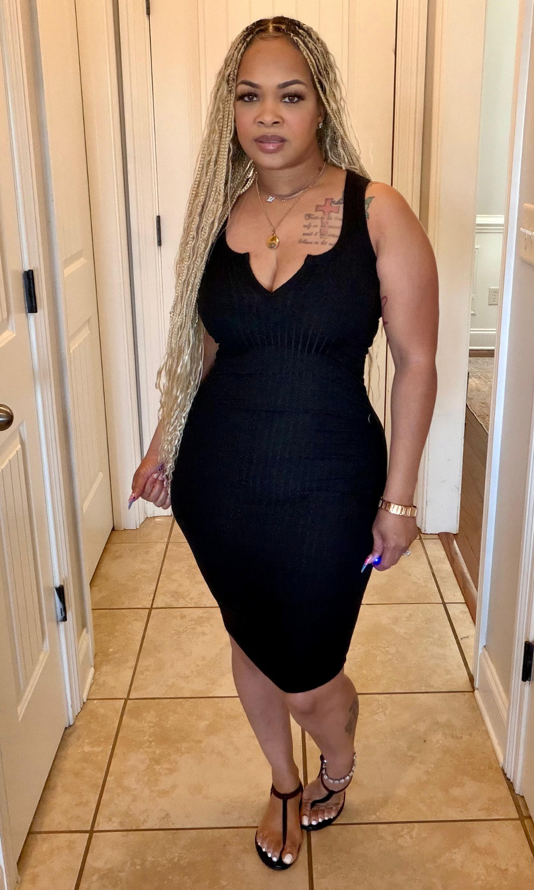 Women’s ribbed black midi dress front view fitted silhouette