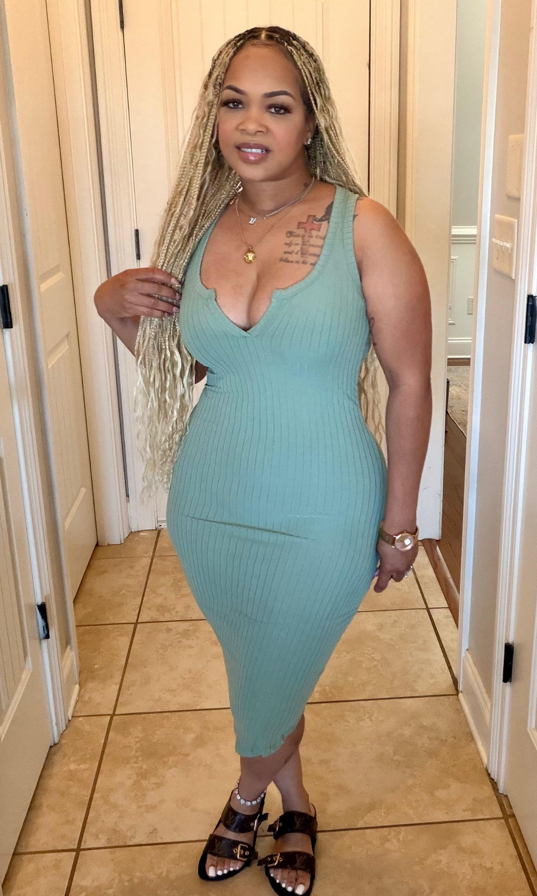 Green ribbed bodycon midi dress front view sleeveless fitted style