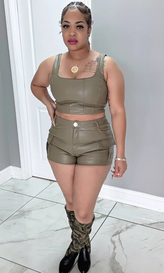 Front view of Set It Off faux leather two-piece set in olive green, model wearing size large