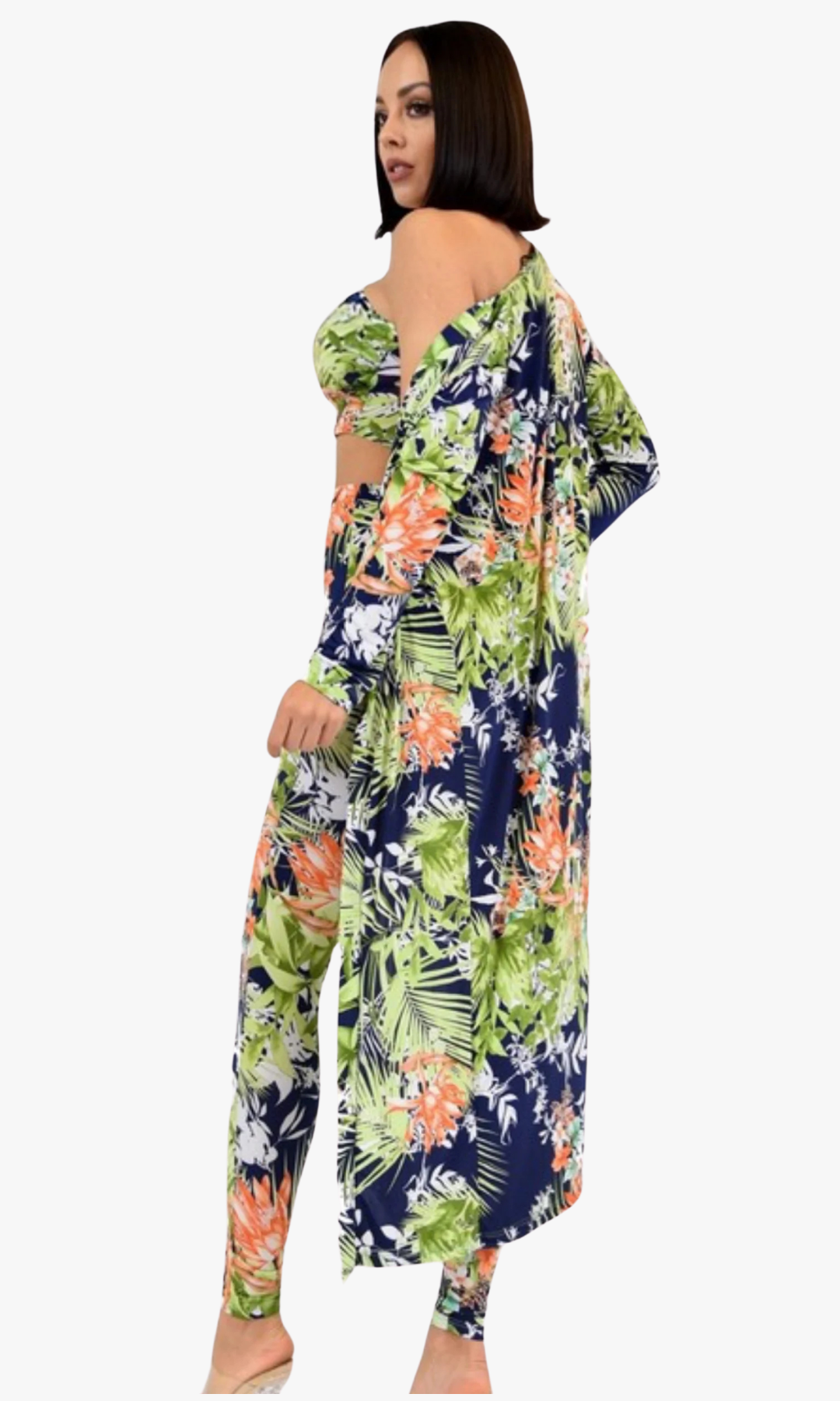 Back view of woman wearing a tropical-print 3-piece set with a strapless crop top, high-waisted leggings, and long cover-up.