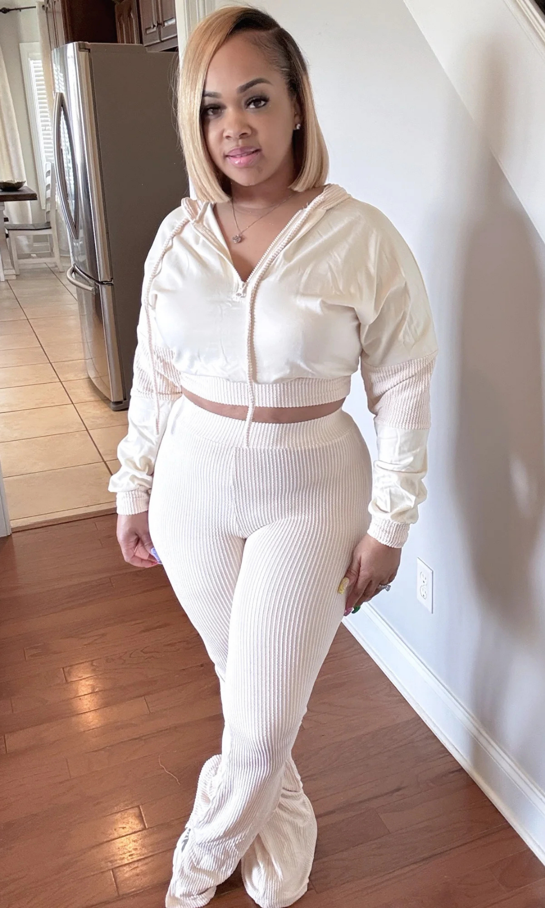 Front view of woman wearing Spring Chill Vibez 2-Piece Set with cropped zip-up hoodie and ribbed high-waist pants.