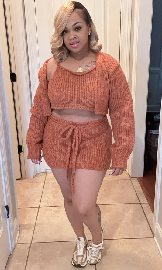 Front view of woman wearing the Style Me Brown 3-piece knit set in warm brown, paired with gold sneakers.