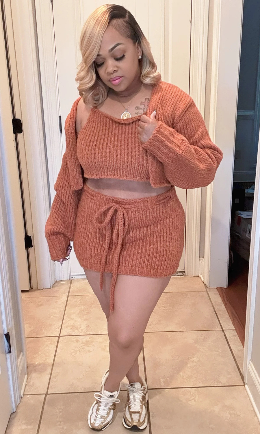 Side-front view of woman wearing the Style Me Brown 3-piece knit set, cardigan draped off the shoulder.