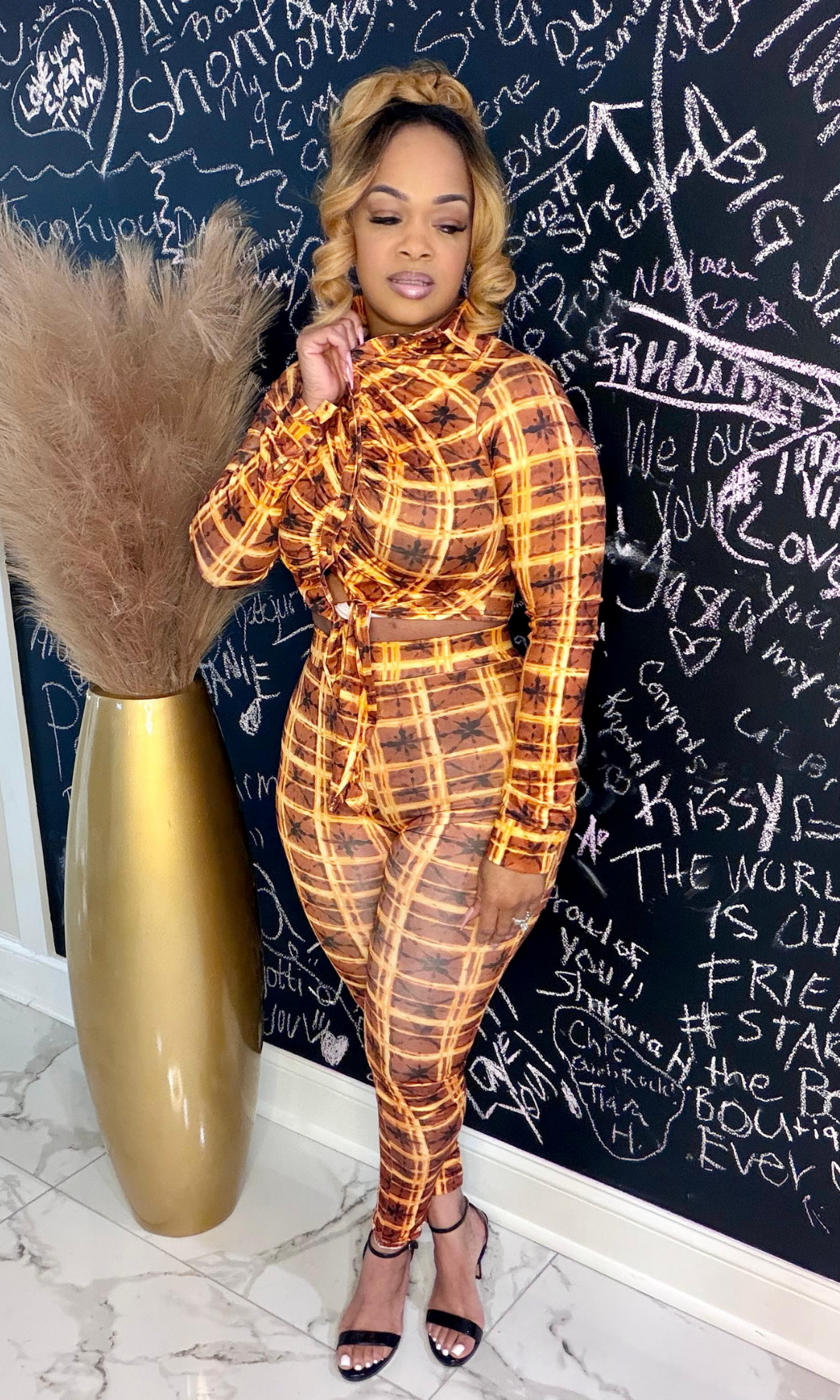 Back view of Sunrise Golden curve-hugging two-piece outfit