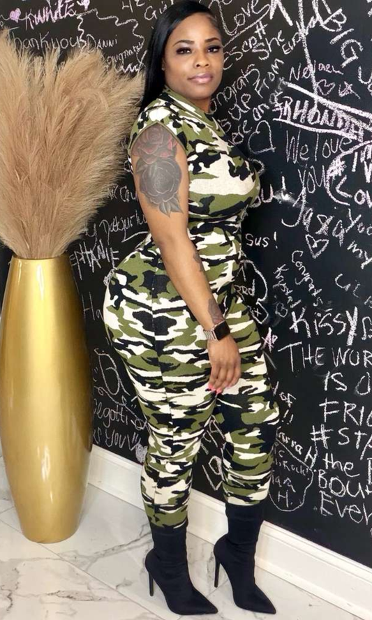 Model wearing The Camo Command Jumpsuit with sleeveless fitted design