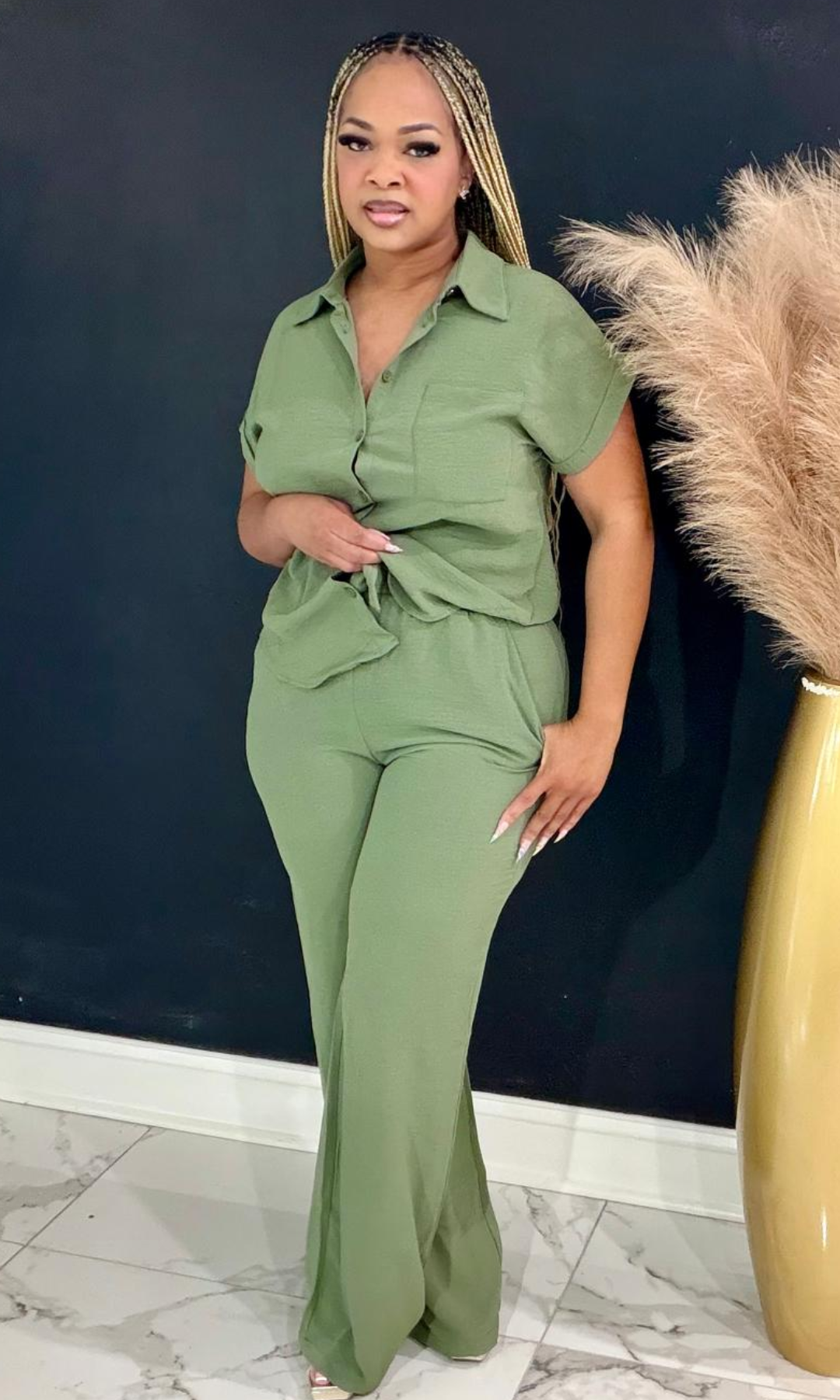 The First Lady Olive two-piece set featuring a button-front collared blouse, high-waisted wide-leg pants, and a timeless silhouette for polished everyday elegance.