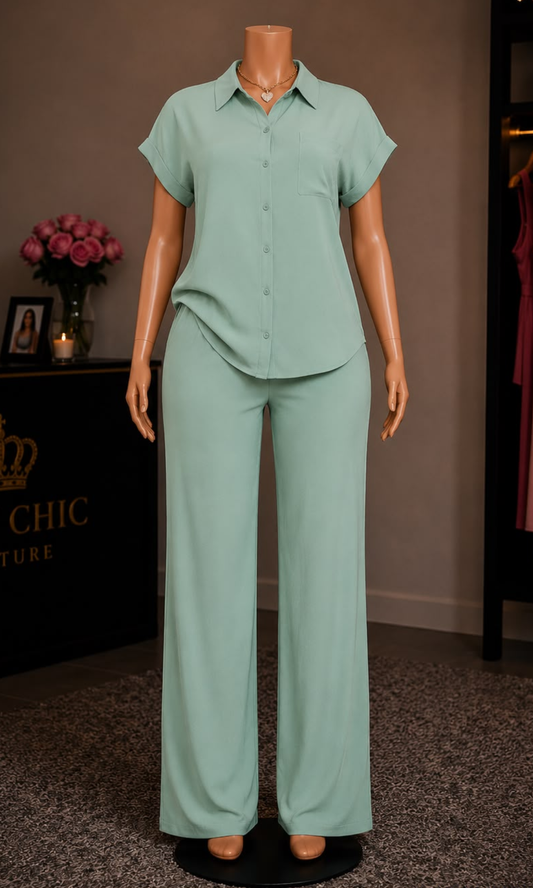 Women's sage green two-piece matching set featuring a relaxed button-up collared blouse with short cuffed sleeves and wide-leg elastic waist pants.
