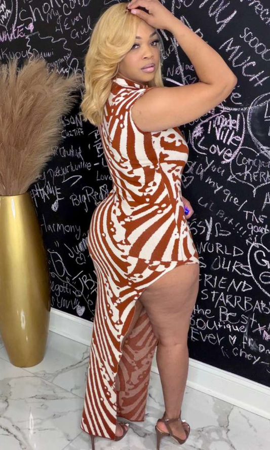 Model wearing The Rust Zebra Knit Dress featuring rust and ivory zebra print with asymmetrical hem