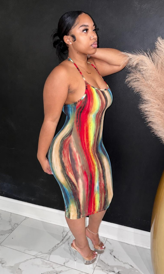 The Undecided Dress features a vibrant abstract print, soft stretch fabric, and a flattering bodycon silhouette that brings bold color and confidence to every occasion.