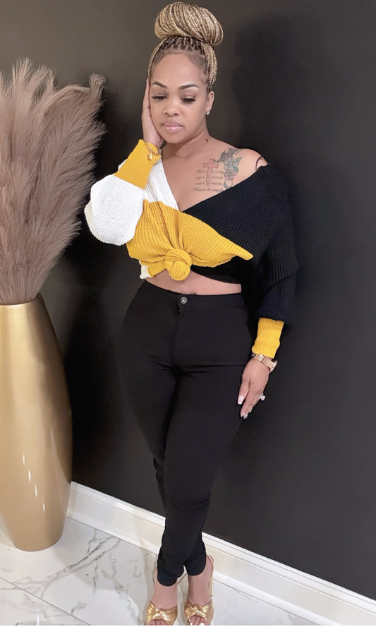 Front view of model wearing Yellow Fallover oversized sweater with bold color block design.