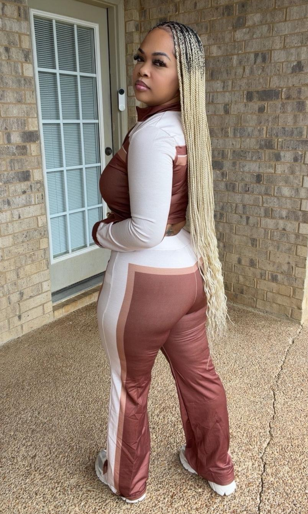 Side and back view of the Cashmere Set Brown showing the fitted cropped jacket, contrasting color-block panels, and matching wide-leg pants.