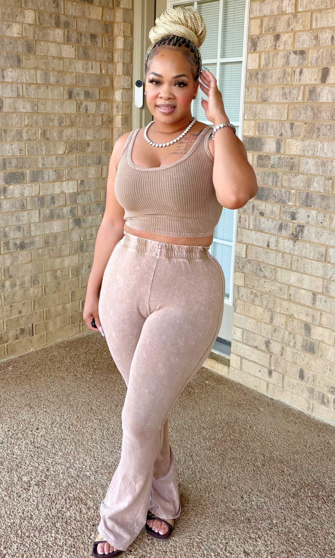 Woman wearing the Cinnamon Twist two-piece set featuring a cinnamon-taupe ribbed crop tank and matching high-waisted wide-leg pants.