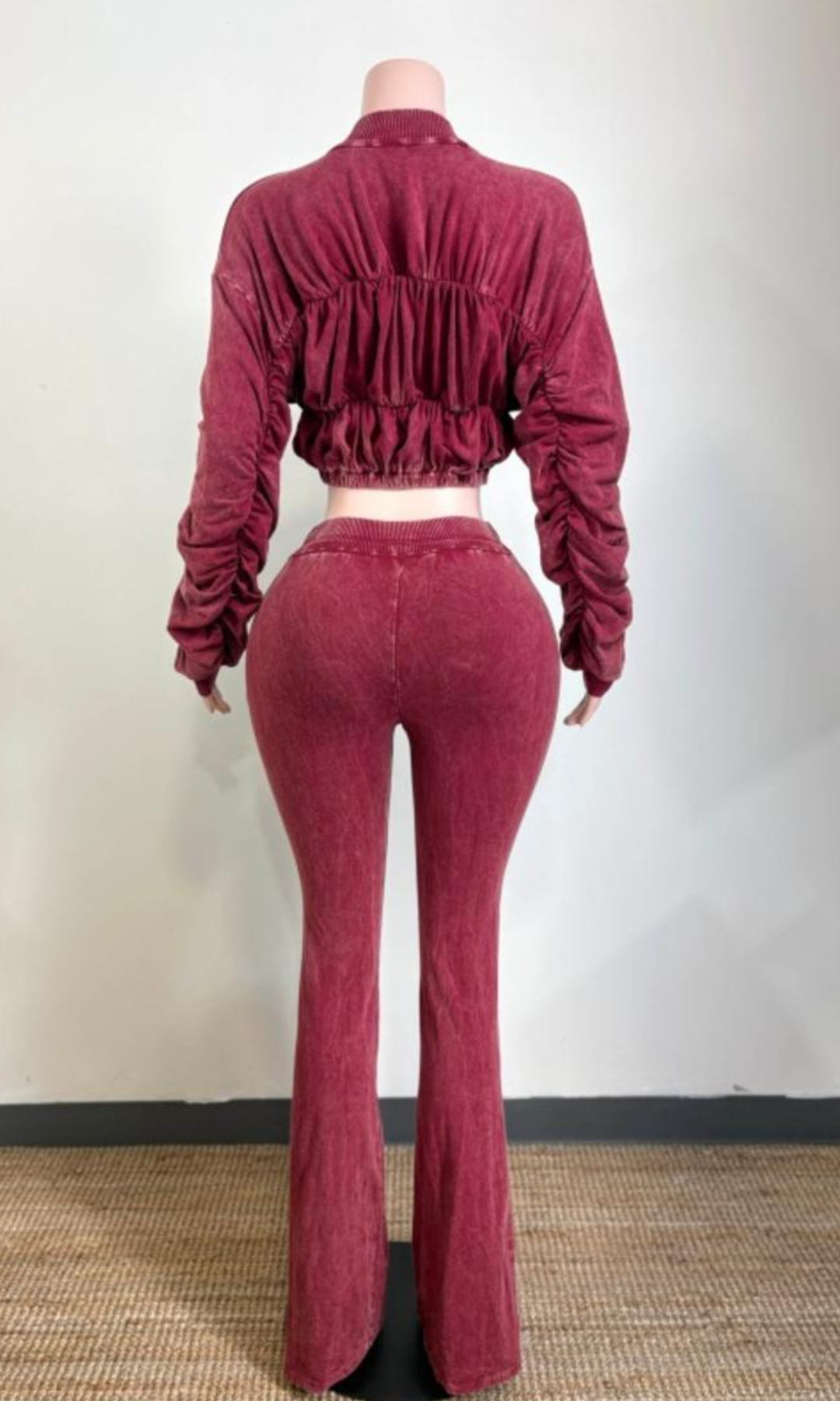 Back view of The Weekend Ruched Set Red showing ruched detailing across the cropped jacket, gathered sleeves, elasticized hem, and matching high-waisted flared pants.