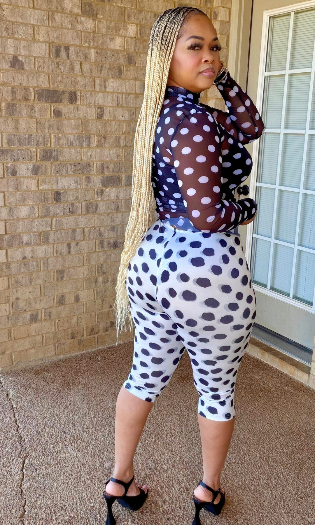 Side and back view of the Too Fly To Blend Set showing the sheer polka dot mesh top and fitted high-waisted printed biker shorts.